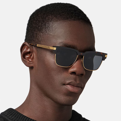 man wearing golden versace sunglasses.jpg