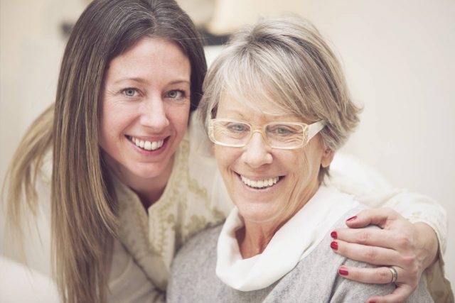 Older lady with Diabetic Retinopathy, posing with her adult daughter