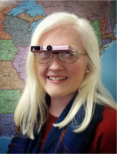 Alyssa, woman with Albinism wearng low vision glasses