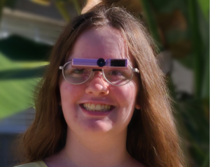 woman wearing low vision glasses