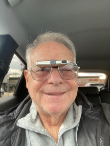 happy man with low visoin glasses