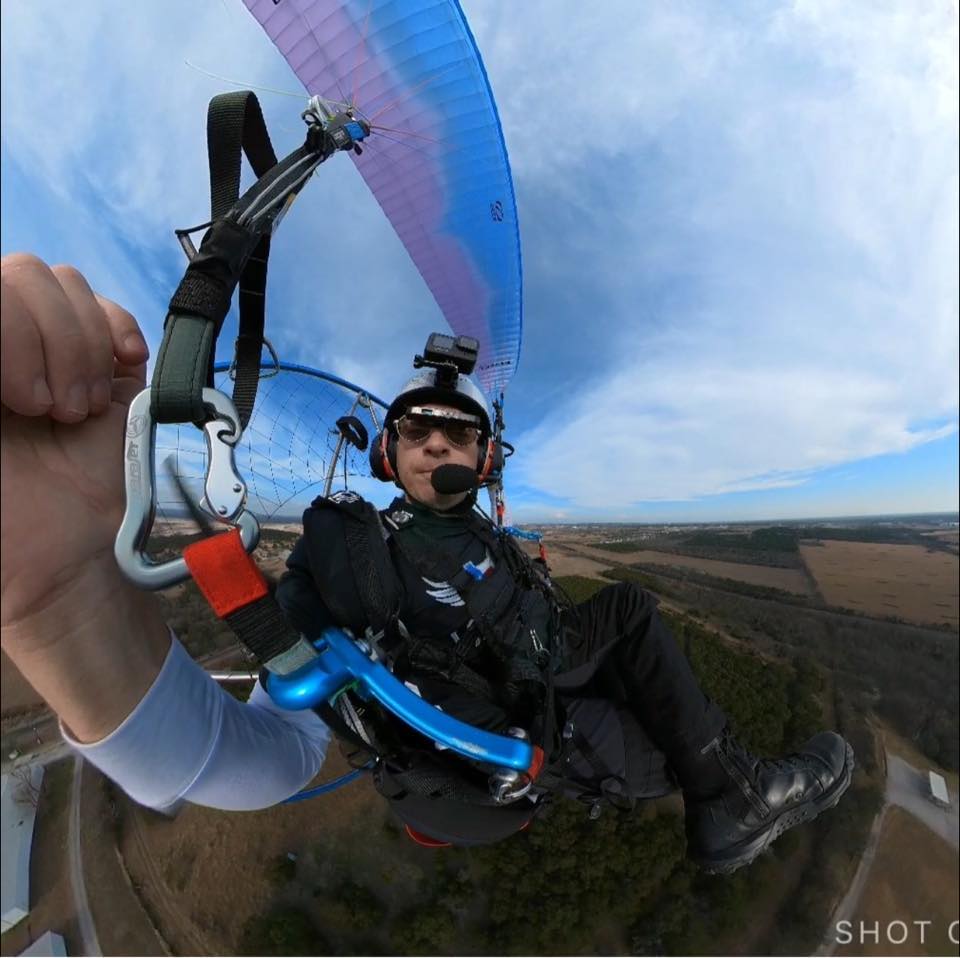man paragliding