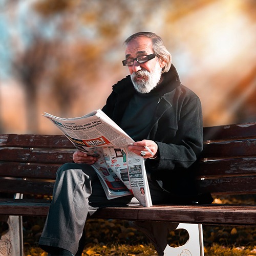 optometrist, senior man reading newspaper