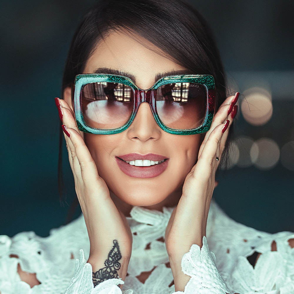 woman wearing large sunglasses