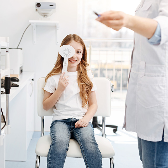 optometrist with young patient