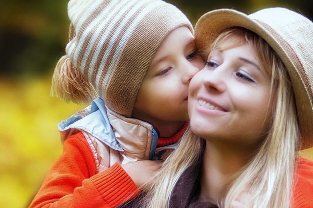 Child Kissing Mother Outdoors 1280×480