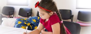 Girl Child Doing homework 1280x480