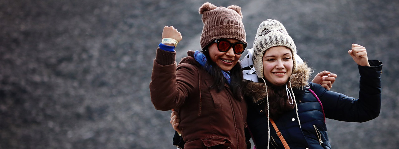 2 college students in winter hats & sunglasses - eye doctor - Seattle, WA