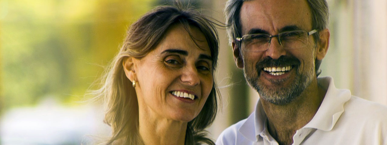 Middle-age couple with presbyopia and multifocal glasses
