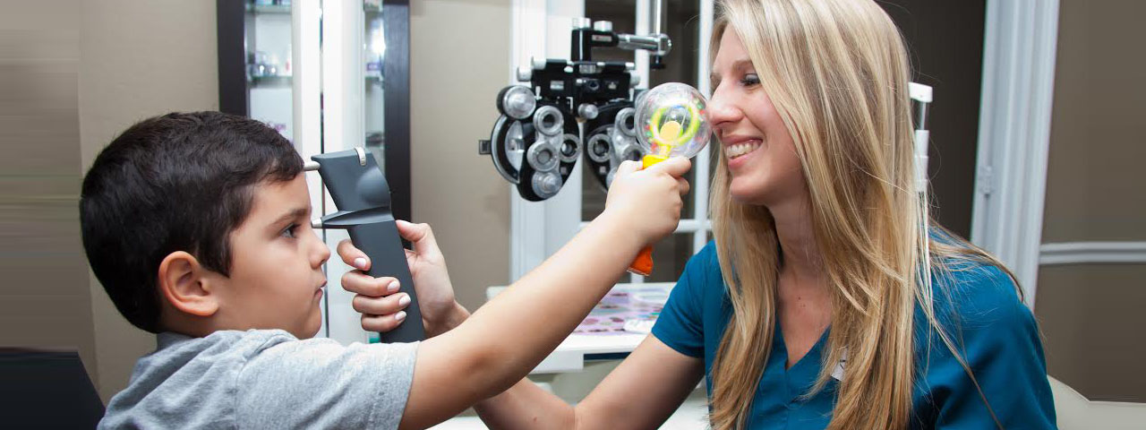 Eye exam, Doctor and child having eye exam with Care tonometer medical examin in Irvine & Laguna Beach, CA