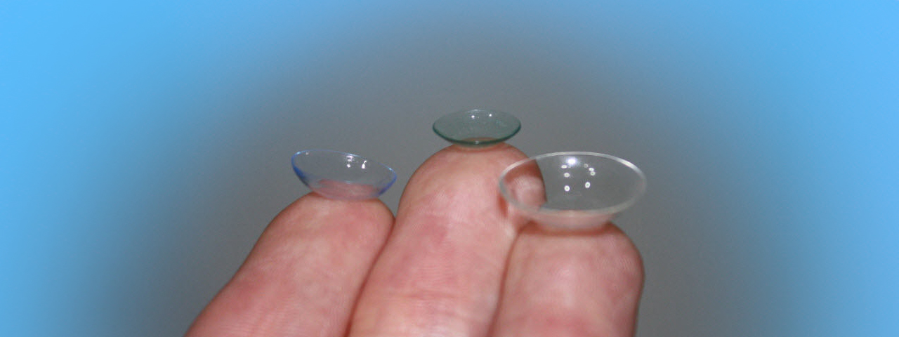 Various types of contact lenses on finger tips