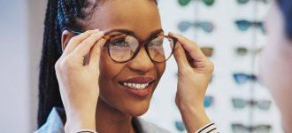 African Woman Trying on Glasses 1280x853 330x150