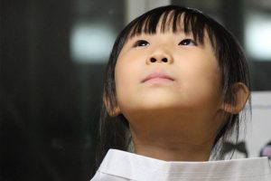 asian girl looks up