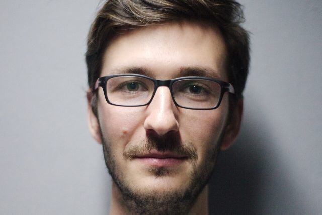 young man glasses portrait 1280x853