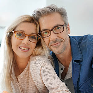 Eye doctor, middle aged couple with eyeglasses in Concord, NC