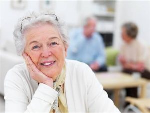 senior woman smiling after eye disease screening