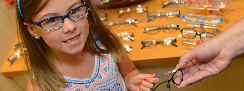 little girl trying on glasses in Middletown NJ