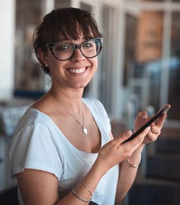woman with glasses, mobile phone, smile