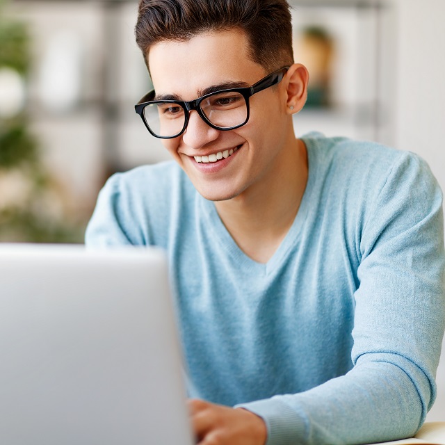 young man online booking eye exam