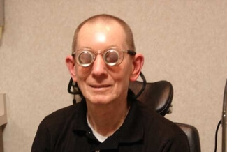 man wearing low vision glasses.jpg