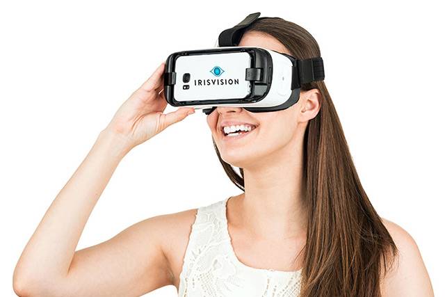 Woman using Iris Vision Low Vision Device