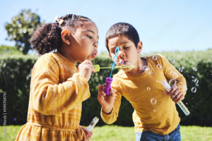 Children playing bubbles