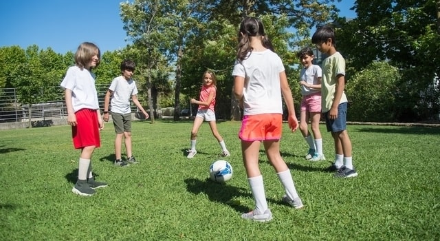 children playing soccer outdoors 640x350 min