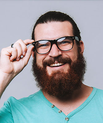 trendy man smiling beard glasses