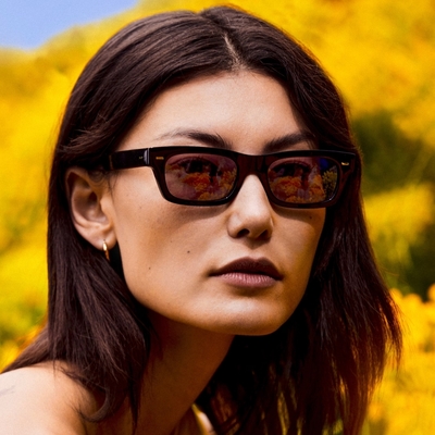 woman wearing brown oliver peoples sunglasses