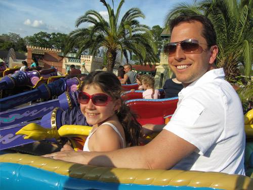 dad with daughter on ride