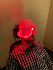 Patient undergoing low level light therapy for dry eye