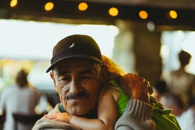 grandpa with grandchild with macular degeneration