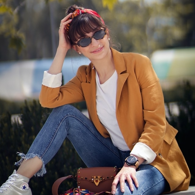 woman in brown jacket wearing sunglasses 640