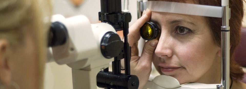 Optometrist, senior woman at a diabetic eye exam in Fairfax, VA