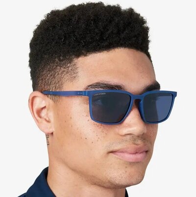 man wearing blue tinted kenneth cole sunglasses