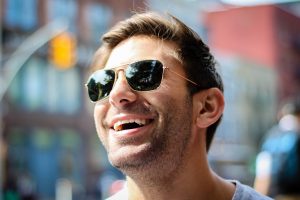 Man laughing, Wearing Fashion Sunglasses at Lougheed Town Centre Optical & Optometry in Burnaby, BC