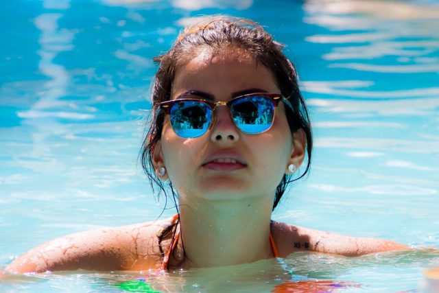 Woman in Pool Sunglasses 1280×853