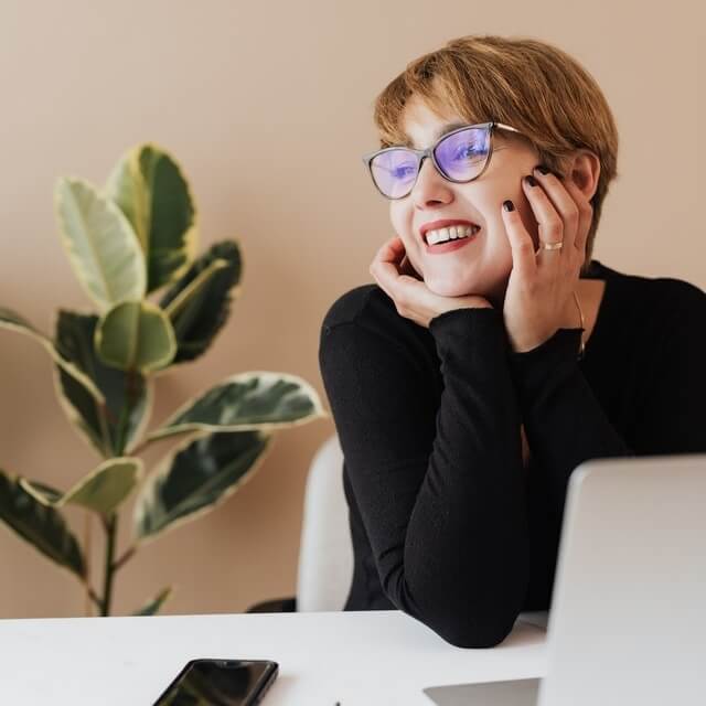 happy woman wearing computer glasses 640×640