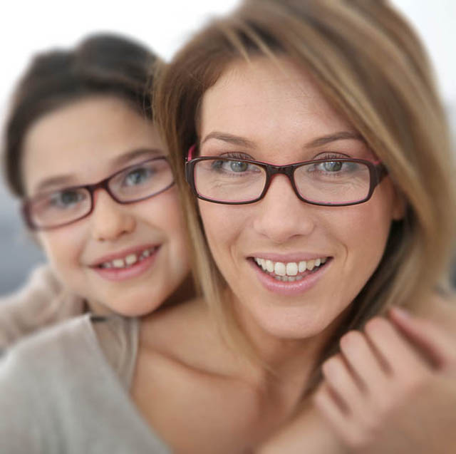 mom and daughter smiling with glasses