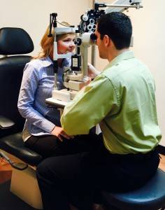 Eye Doctor performing eye exam inside Walmart Vision Centre