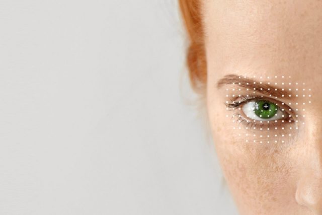 Close-up of woman's eye, illustration of LASIK