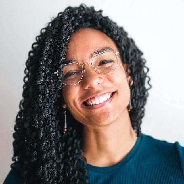 african american woman wearing glasses smiling