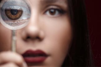 dry eye woman with magnifying glass.jpg