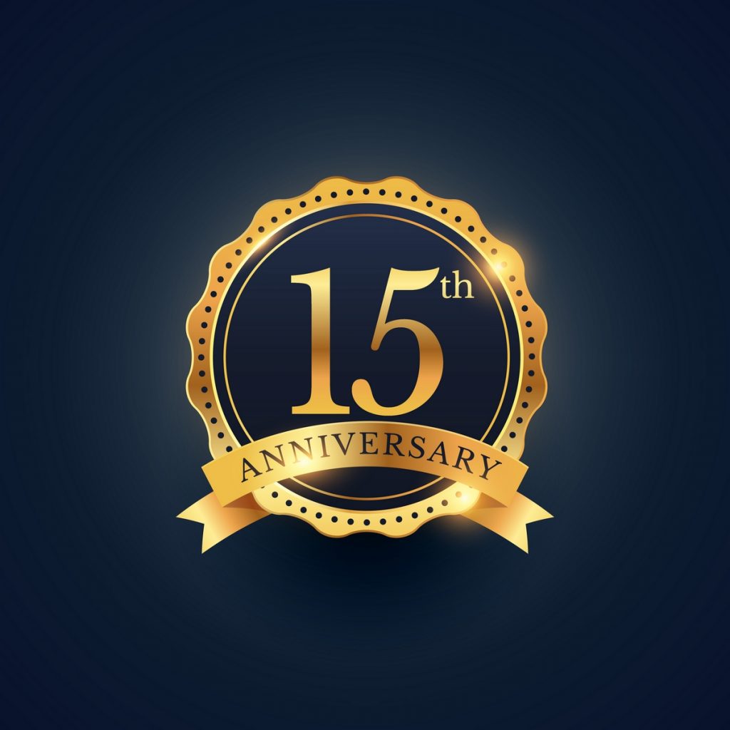 15th anniversary celebration badge label in golden color