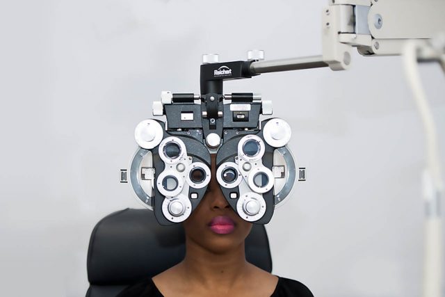 Eye doctor, woman at an eye exam in Grand Prairie, TX