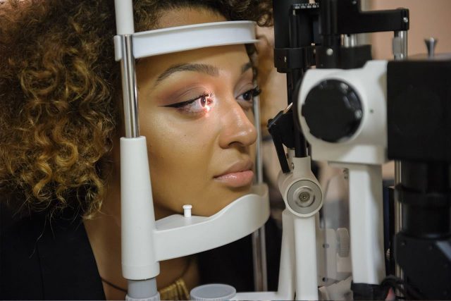 Optometrist, african american women at an eye exam in Sacramento, CA