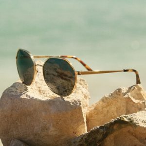 pair of michael kors sunglasses on a rock.jpg
