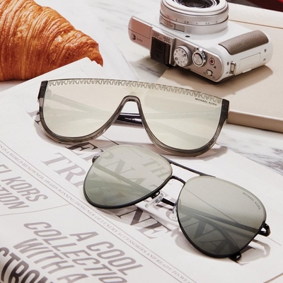 pairs of michael kors sunglasses on a table 400×400