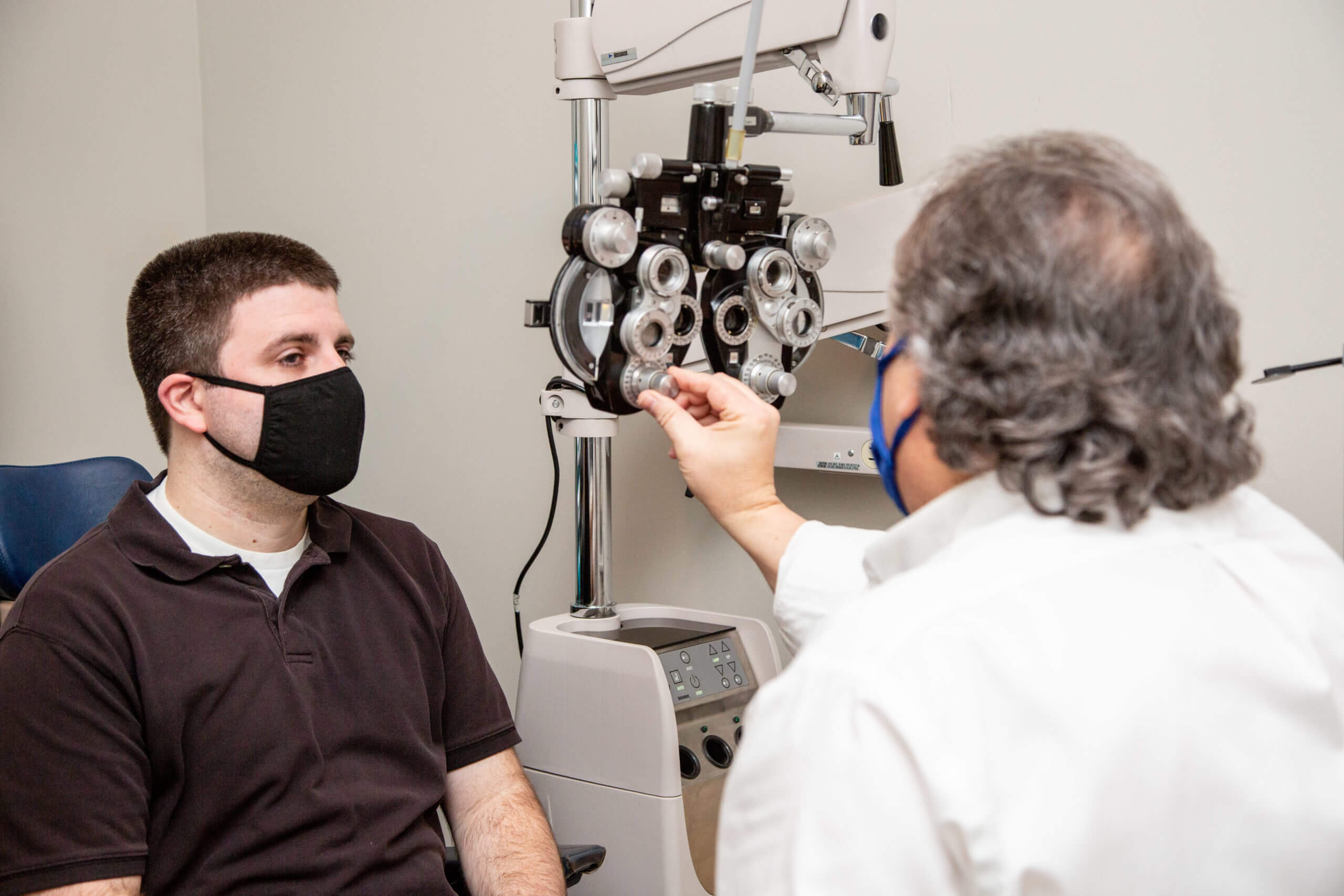 Eye Doctor Showing Eyeglasses, Optometrist in Clay, NY