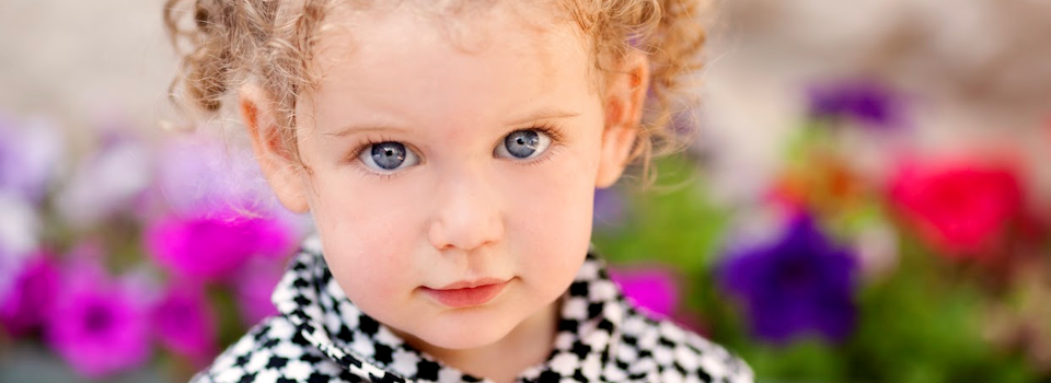 girl-with-blue-eyes-in-black-and-white-coat-slide.png